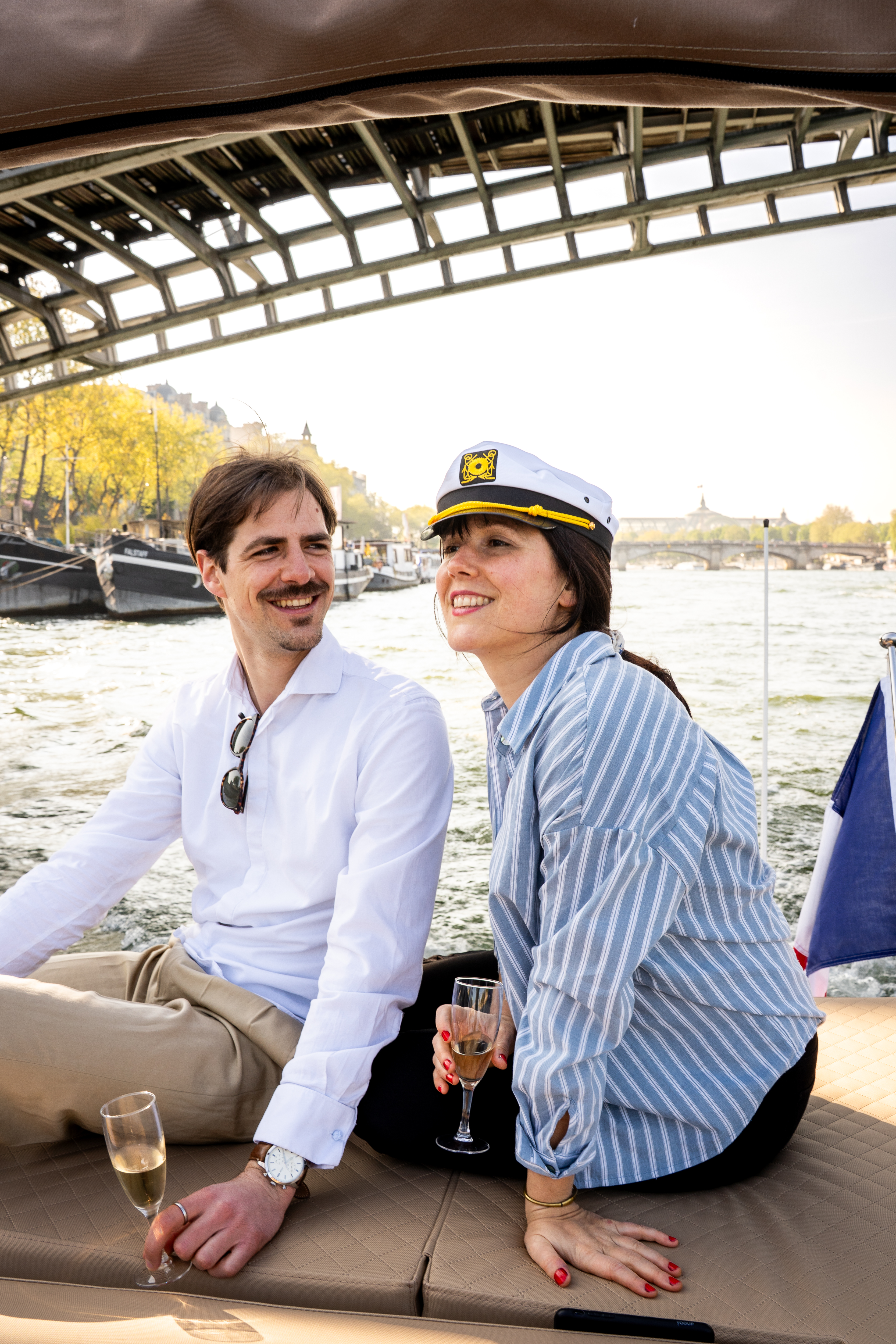 Couple relaxing on a private boat tour in Paris on the Seine